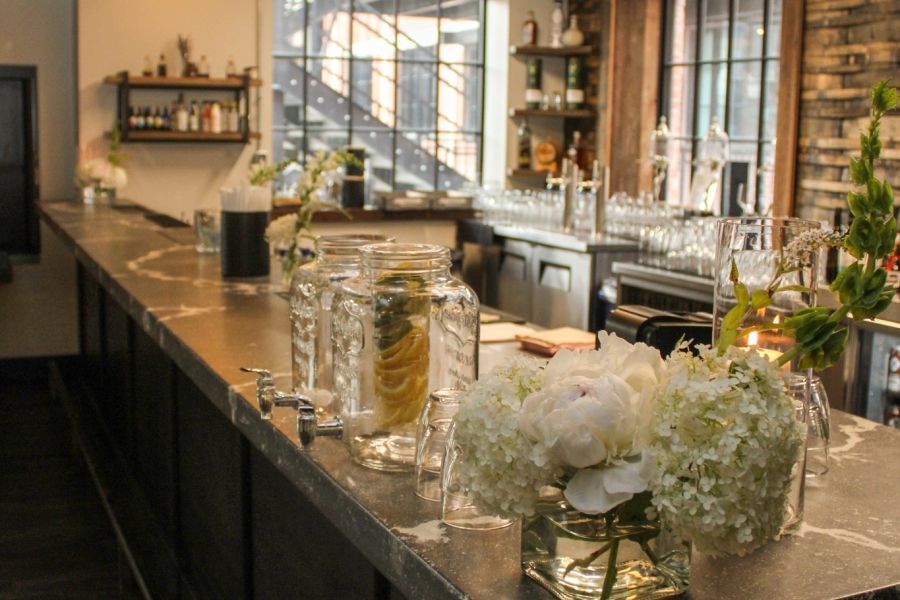 Flowers on a bar inside Paradigm event space in London Ontario