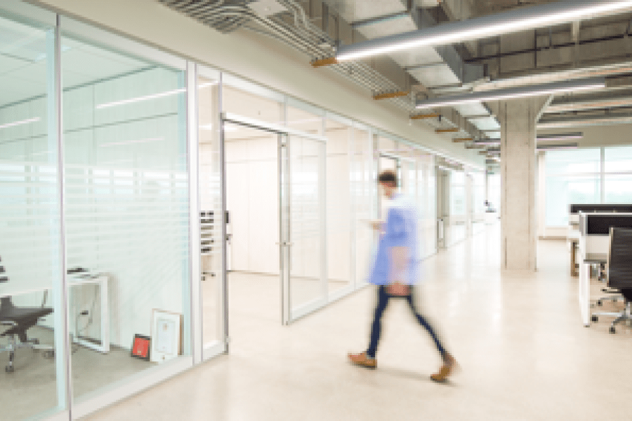 Man walking through office space